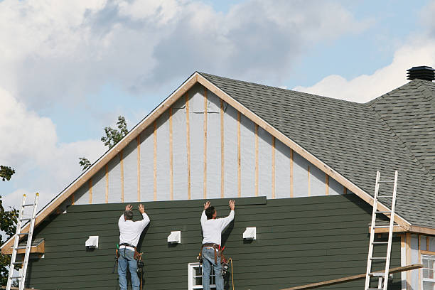 Professional Storm Damage Siding Repair technician working in Trenton, OH